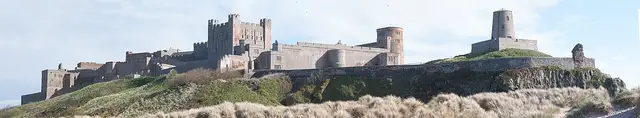 Northumberland coast — Bamburgh beach castle panorama (27823914395)